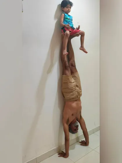 Another view of our father-son handstand. His complete trust and my steady base create a beautiful picture of balance and connection.