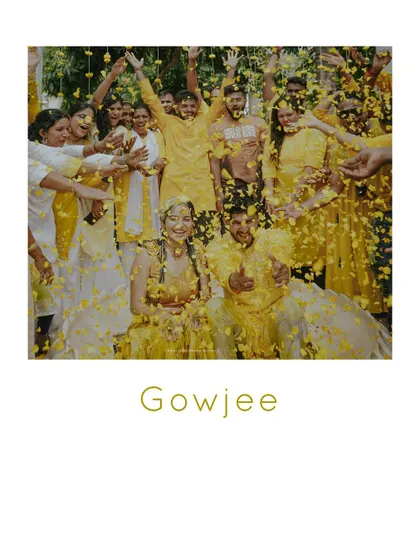 A beautiful moment of celebration as the couple is showered with marigold petals during their Haldi ceremony.