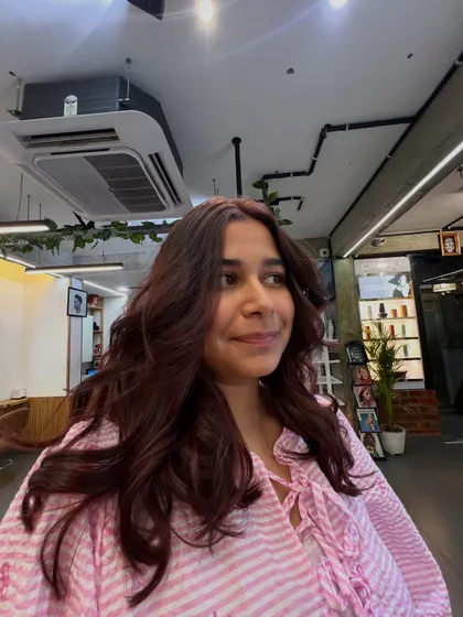 A happy client showing off her new color. Seeing my clients smile is the most rewarding part of my job.