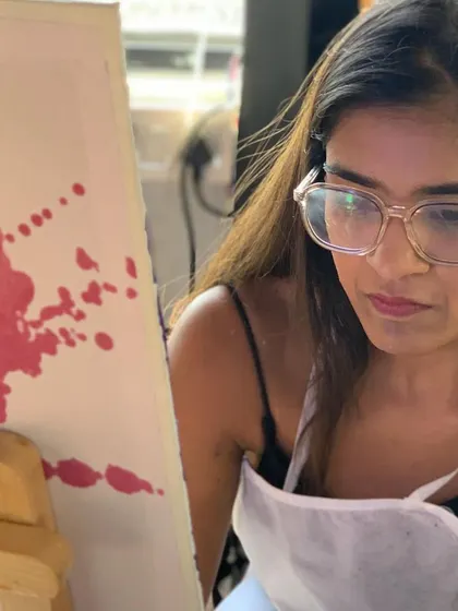 A painter deep in thought, working on her Starry Night canvas. Recreating a masterpiece is a meditative and rewarding process.