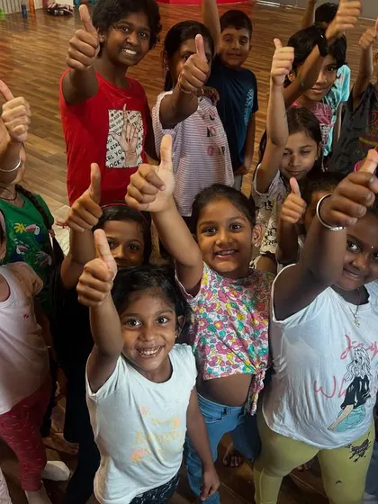 Thumbs up from our youngest and most enthusiastic dancers. Their smiles say it all; our classes are all about having fun while learning the fundamentals of dance.