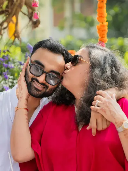A mother's love captured in a sweet kiss during the groom's Haldi. These are the emotional candids that families will treasure forever.
