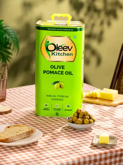 For this warm, rustic kitchen setup for Oleev, we used props like a gingham tablecloth, bread, and cheese to create a cozy, homely atmosphere. The leafy shadows in the background add character and depth.