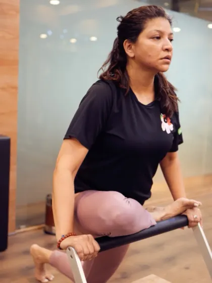 Using the stability chair for a deep lunge, this client demonstrates how we work on core stability and lower body strength simultaneously. The focus is on controlled, mindful movement.