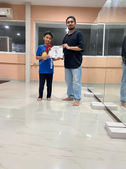 Students from my kids' batch receiving their certificates. I offer certification to validate the hard work and dedication they put into their training.