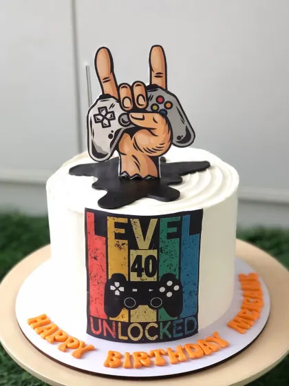 Level 40 unlocked! A retro-style gaming cake to celebrate a milestone birthday for a lifelong gamer.