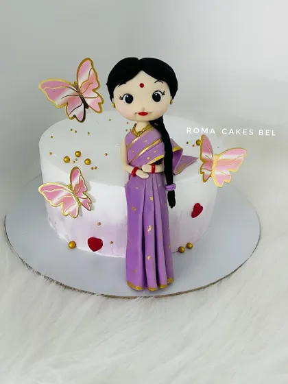 Another view of the beautiful saree-clad figurine, showing the delicate gold details on her dress.