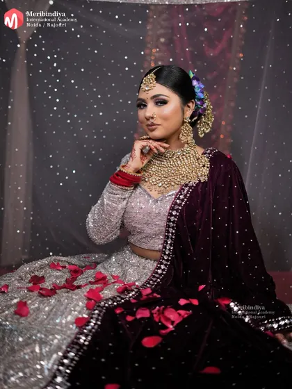 A full view of the contemporary bride, where the hairstyle perfectly balances the elaborate lehenga and jewelry for a sophisticated look.