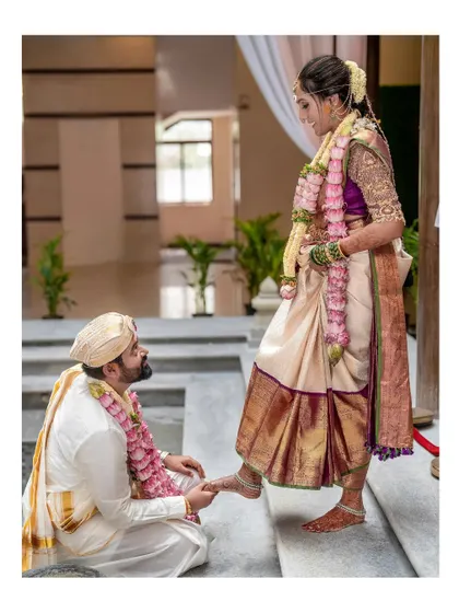 A tender and traditional moment where the groom adorns the bride's feet. I capture these intimate rituals with respect and an eye for beautiful composition.