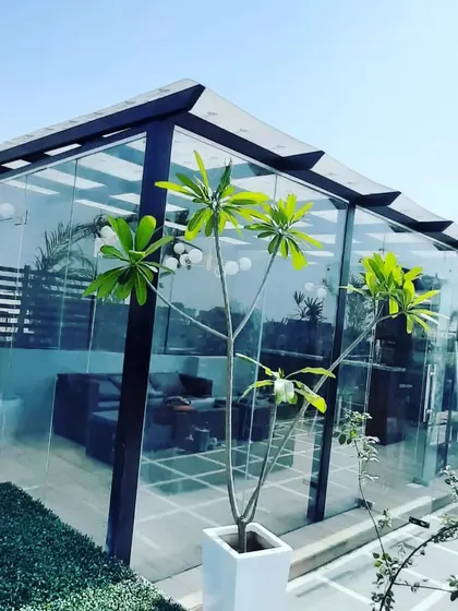 The architectural details of our glass rooms, including the sloped roof and sturdy frame, are designed for both durability and style, ensuring your investment lasts for years.