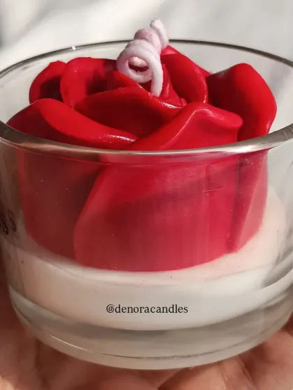 A side view of the red rose jar candle.