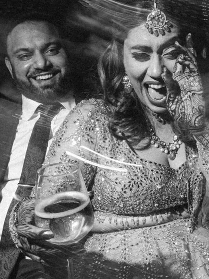 The beautiful chaos of a cocktail night. This candid, black and white shot uses motion blur to freeze a moment of pure laughter and energy, telling the story of a night filled with fun, drinks, and unforgettable memories.