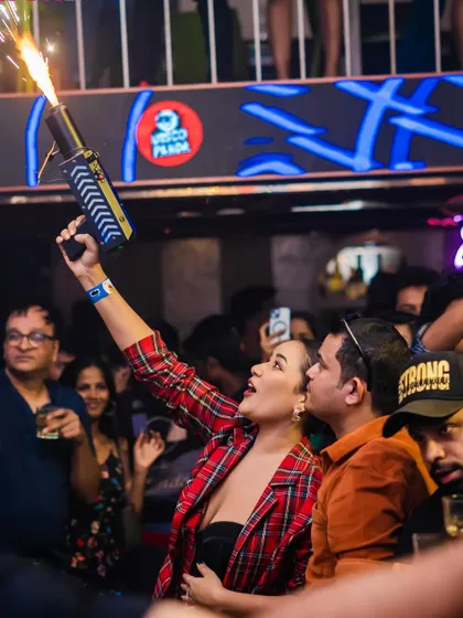 A guest firing a confetti gun into the crowd. I love getting the partygoers involved, making them part of the show and creating an interactive, high-energy nightlife experience.