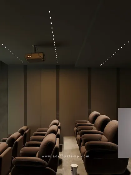 A variety of our architectural ceiling lights, shown here in a home theater setting. These small, powerful lights provide precise, low-glare illumination, perfect for creating a cinematic experience or highlighting architectural details.