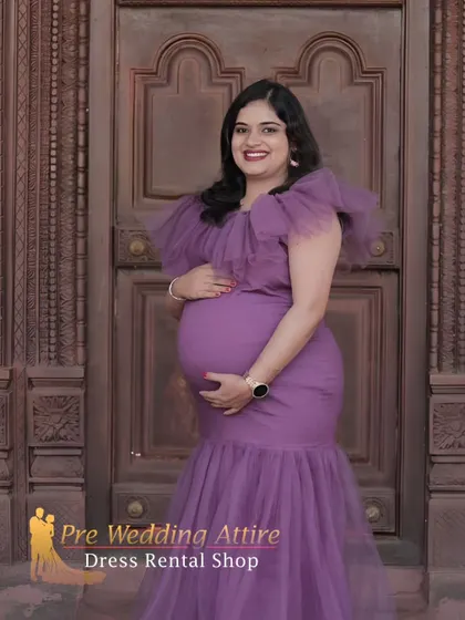 This indoor portrait shows the versatility of the purple mermaid gown. The rich color and elegant silhouette look just as stunning in a more formal setting against a classic wooden door.