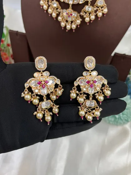 A showcase of our various maang tikkas, designed to match our premium Kundan and Moissanite necklace sets. These accessories complete the bridal look and are a key part of our wholesale sets.