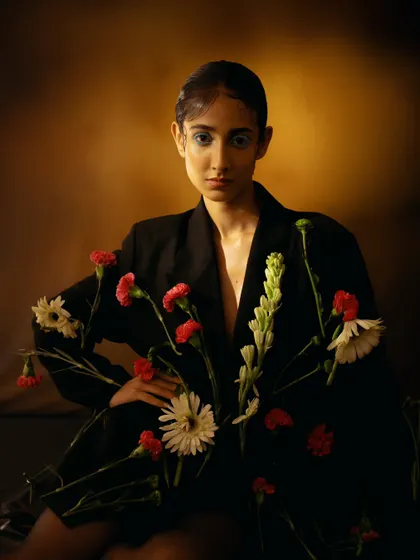 A full-frontal portrait from our floral concept shoot. The direct gaze and unique styling make this a strong and artistic addition to any portfolio.