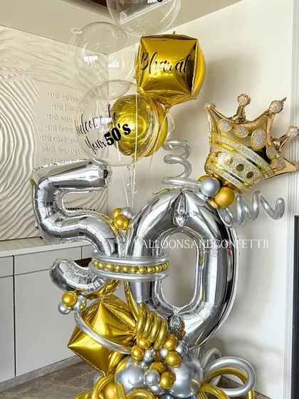 Another angle of the stunning 50th birthday bouquet, highlighting the gold crown and the custom "Welcome to your 50's" message.