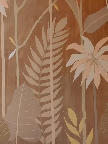 A close-up of a tropical mural with a warm, earthy color scheme. The soft tones create a very soothing and sophisticated atmosphere.