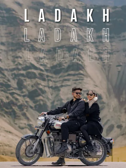 Adventure awaits in Ladakh. This shot captures the thrill of the journey on a classic Royal Enfield against the rugged mountain terrain.