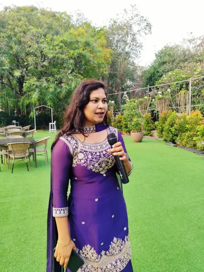 Speaking with guests during an engagement ceremony. I believe in creating a personal connection, moving through the crowd to ensure everyone feels like a part of the event.