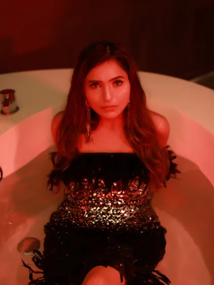 A direct, intense portrait from the bathtub series, with the red light creating a powerful mood.