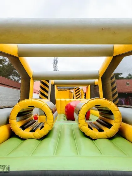 An inflatable obstacle course that provides a fun challenge for kids and even adults. It's a great way to get everyone active and laughing.
