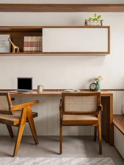This versatile room in our 'Palaash' project serves as a mini home office, a cozy library, and a recreational nook. A smartly designed platform transitions into a bed, making the space adaptable for work, reading, or lounging.