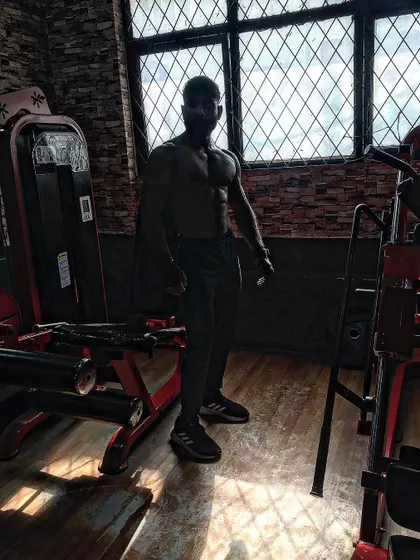 Strive for progress, not perfection. A silhouette shot in the gym.
