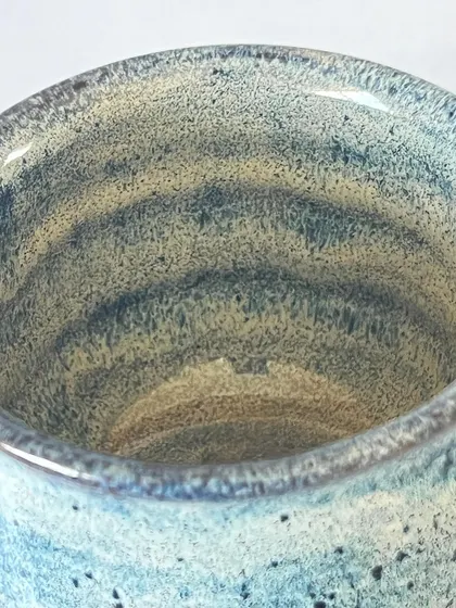 The inside of the blue goblet shows the throwing rings from the pottery wheel, a subtle reminder that it was made by hand.