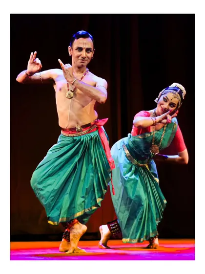 Performing a duet with a senior disciple from the ensemble. This interaction on stage is a dialogue, a shared storytelling between two artists, reflecting a journey of mutual learning and respect.