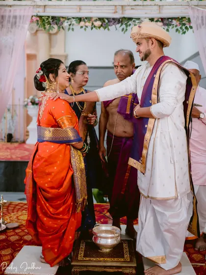 A moment of blessing from the priest during the wedding ceremony.