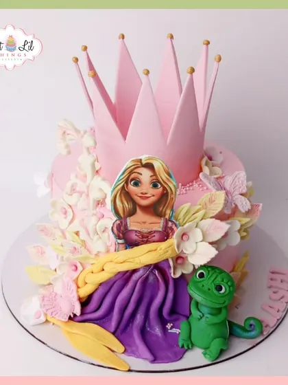 A cake fit for a princess! This Rapunzel-themed cake features the long-haired princess, her friend Pascal, and a large pink crown.