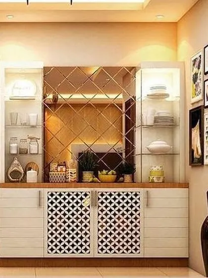 A beautifully crafted crockery unit with lattice-work cabinet doors and a diamond-patterned mirror backsplash. The unit includes glass display shelves with internal lighting to highlight your finest dinnerware.