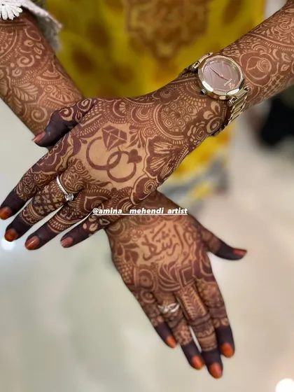 A closer look at the one-day stain of this engagement mehendi. You can see the clarity of the ring design and the Urdu calligraphy, which will continue to darken.