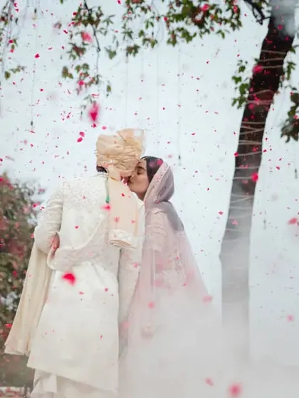 A kiss that seals the promise, surrounded by a magical haze and a shower of flowers. This moment between Nidhi and Divya is the fairytale ending to their ceremony and the beginning of their forever.