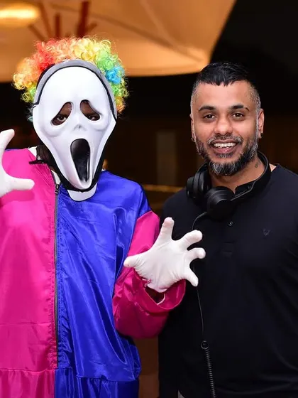 Having some fun with a guest in costume at a Halloween party. Themed events are all about engagement, and I make sure the music and my interaction fit the part.