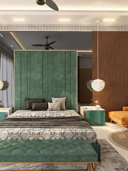 Another view of the green and wood bedroom, showing the integrated seating area with a vibrant orange sofa. This demonstrates how I use bold color choices to add personality and create distinct zones within a single room.