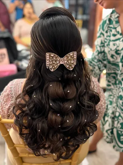 A behind-the-scenes look at the creation of this playful and chic hairstyle. It's perfect for a sangeet or bachelorette party.