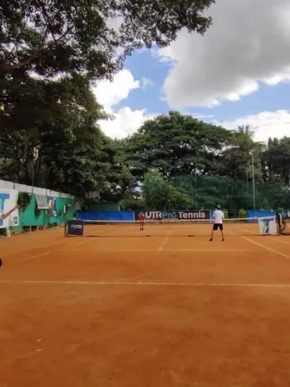 A young player honing her skills on our expansive clay court. The playing surface is consistently prepared to provide a true and reliable bounce.