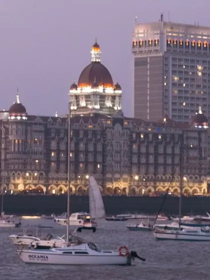 The iconic Mumbai skyline at dusk, seen from our yoga yacht. It's a reminder that you can find peace and beauty right in the heart of the city.