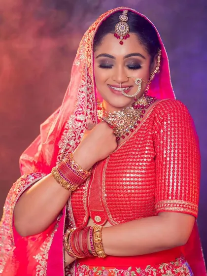 A beautiful close-up of the bride-to-be, capturing the joy and radiance of the moment in our rental lehenga.