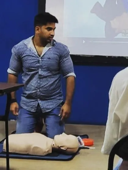 A trainer practices his first aid skills during our team-wide CPR certification. We are prepared and equipped to ensure your well-being at all times.