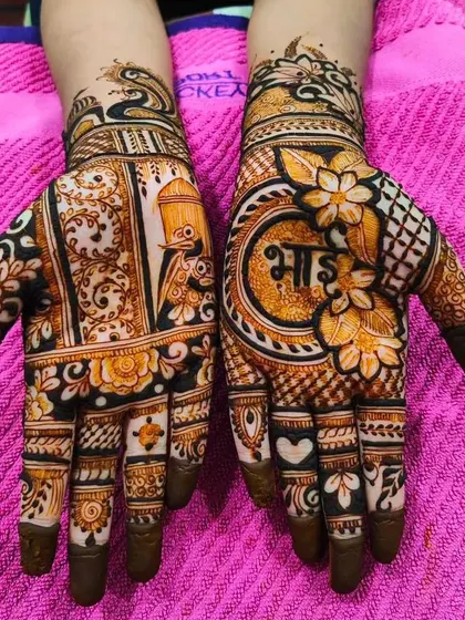 This design was created for a brother for the Rakshabandhan festival, with the word 'Bhai' (brother) written in a central mandala.