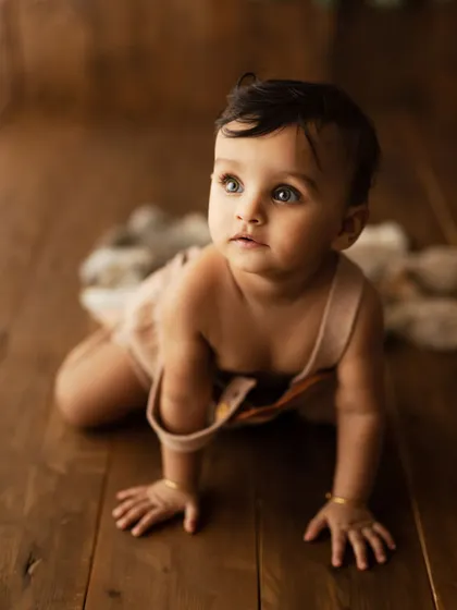 A baby on the move! This shot captures the exciting crawling stage, full of energy and curiosity.