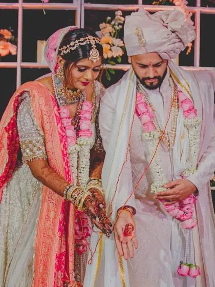 A sacred moment during the pheras, where the couple makes their vows. We ensure the sanctity of these rituals is maintained amidst the grand celebration.