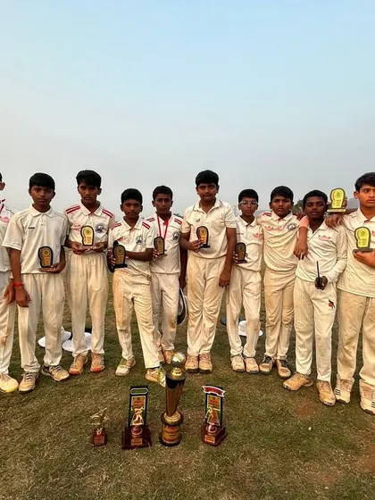The entire U-12 squad with their individual and team trophies after a successful tournament run.