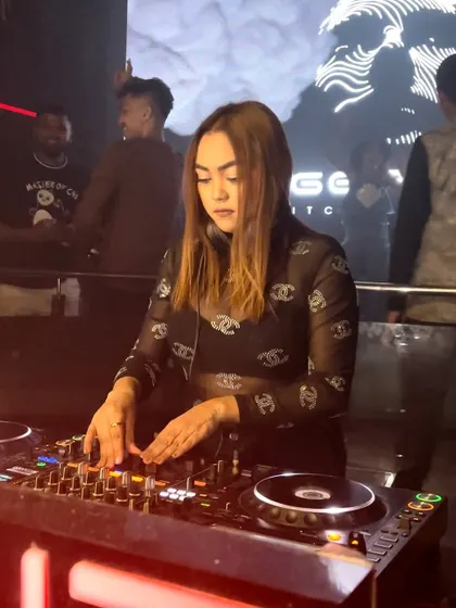 A clear shot of me at the console in a club, showing my focus and the professional setup.