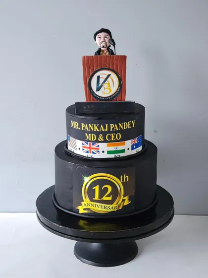 This corporate cake was for a company's 12th anniversary, with a special request to feature the MD giving a speech. I sculpted his figurine at a podium, complete with the company logo, creating a professional and customized cake for the event.