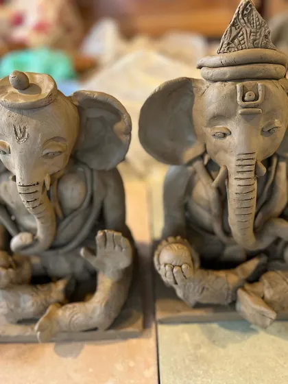 Every Ganesha idol is unique, just like the person who makes it. Here are a few different idols sitting side-by-side, each with its own personality and charm.